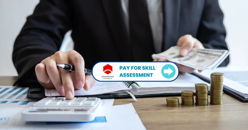 Engineer calculating Engineers Australia (EA) Fee for skill assessment with calculator, cash, and financial documents on desk